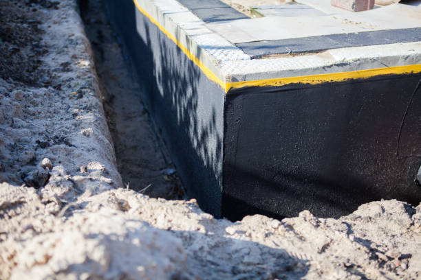 Professional Waterproofing technician working in Somerville, NJ